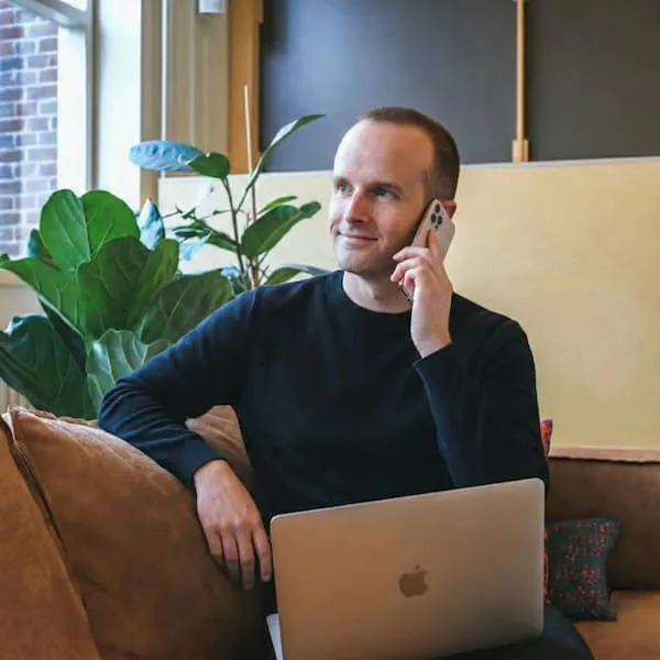 Ross Merriam speaking to a client about website development projects.